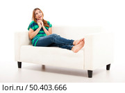 Woman in love answering the phone, isolated on white. Стоковое фото, агентство Ingram Publishing / Фотобанк Лори