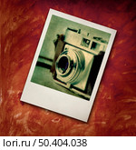Polaroide frame with a image of a Old fashioned photography camera. Стоковое фото, агентство Ingram Publishing / Фотобанк Лори