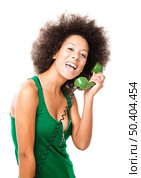 Afro-American young woman answering a call, isolated on white background. Стоковое фото, агентство Ingram Publishing / Фотобанк Лори