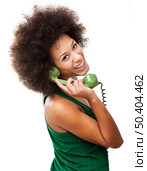 Afro-American young woman answering a call, isolated on white background. Стоковое фото, агентство Ingram Publishing / Фотобанк Лори