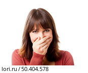 Happy woman having a great surprise and covering her face with the hand, isolated on white backgriund. Стоковое фото, агентство Ingram Publishing / Фотобанк Лори
