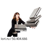 Woman in the office stumbling with a pile of folders in the hands, isolated on white. Стоковое фото, агентство Ingram Publishing / Фотобанк Лори
