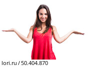 Beautiful young woman with arms open making a scale, isolated over a white background. Стоковое фото, агентство Ingram Publishing / Фотобанк Лори