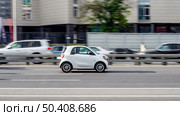 Smart Fortwo W453 Third generation Microcar manufactured by German multinational Daimler AG. City car moving on street at high speed. Редакционное фото, фотограф Константин Григорьев / Фотобанк Лори