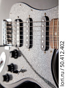 soundboard of an electric guitar close-up. shape of stratocaster, humbucker and 2 singles. Стоковое фото, агентство Ingram Publishing / Фотобанк Лори