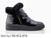 Comfortable patent leather boots. On a white background. Стоковое фото, агентство Ingram Publishing / Фотобанк Лори