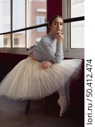beautiful ballerina tutu skirt posing window. Стоковое фото, агентство Ingram Publishing / Фотобанк Лори