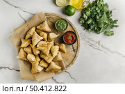 delicious pakistani food with sauce flat lay. Стоковое фото, агентство Ingram Publishing / Фотобанк Лори