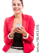 Business woman texting someone, isolated over a white background. Стоковое фото, агентство Ingram Publishing / Фотобанк Лори