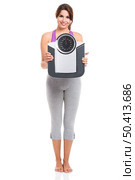 Beautiful athletic woman smilling and holding a scale, isolated on white. Стоковое фото, агентство Ingram Publishing / Фотобанк Лори