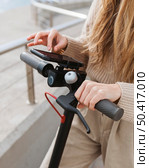 young woman riding electric scooter 9. Стоковое фото, агентство Ingram Publishing / Фотобанк Лори