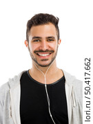 Portrait of latin man smiling and listen music . Стоковое фото, агентство Ingram Publishing / Фотобанк Лори