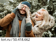couple winter woman covering her boyfriend face. Стоковое фото, агентство Ingram Publishing / Фотобанк Лори