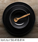 flat lay assortment dinnerware with wooden spoon. Стоковое фото, агентство Ingram Publishing / Фотобанк Лори