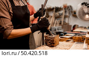 female carpenter sculpting wood studio. Стоковое фото, агентство Ingram Publishing / Фотобанк Лори