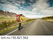 Female backpacker tourist in Icleand ready for adventure . Стоковое фото, агентство Ingram Publishing / Фотобанк Лори