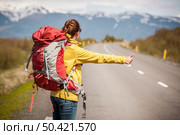 Female backpacker tourist in Icleand ready for adventure . Стоковое фото, агентство Ingram Publishing / Фотобанк Лори