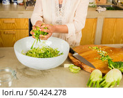 Preparing fermented preserved vegetables. Cabbage kimchi and sauerkraut sour cabbage. . Стоковое фото, агентство Ingram Publishing / Фотобанк Лори