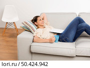Beautiful woman with a dreamer expression enjoying her day at home. Стоковое фото, агентство Ingram Publishing / Фотобанк Лори