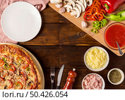 flat lay pizza with red pepper ingredients. Стоковое фото, агентство Ingram Publishing / Фотобанк Лори