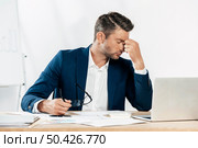 medium shot tired man with glasses. Стоковое фото, агентство Ingram Publishing / Фотобанк Лори