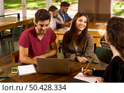 Group of friends studying together for finals. Стоковое фото, агентство Ingram Publishing / Фотобанк Лори