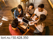 Group of friends studying together for finals. Стоковое фото, агентство Ingram Publishing / Фотобанк Лори