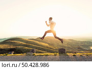 Man in outdoor running and jumping. Стоковое фото, агентство Ingram Publishing / Фотобанк Лори