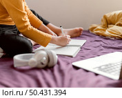 school boy sitting bed. Стоковое фото, агентство Ingram Publishing / Фотобанк Лори
