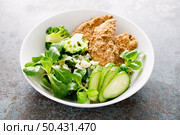 Chicken nuggets with fresh corn salad, broccoli, cucumber and rice. Стоковое фото, агентство Ingram Publishing / Фотобанк Лори