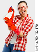 Pretty woman wearing gloves and holding a cleaning spray . Стоковое фото, агентство Ingram Publishing / Фотобанк Лори