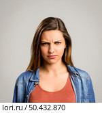 Portrait of a beautiful woman making a worried expression. Стоковое фото, агентство Ingram Publishing / Фотобанк Лори