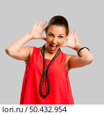 Portrait of a beautiful and happy woman using her hands to listening better. Стоковое фото, агентство Ingram Publishing / Фотобанк Лори