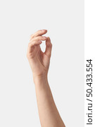 Relaxed female hand half wide open or close palm gesturing holding invisible object vertical position isolated on white background.. Female hand gesture isolated on white. Стоковое фото, агентство Ingram Publishing / Фотобанк Лори