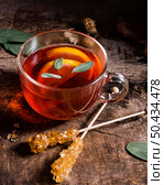 high angle tea with lemon slices crystallized sugar canes. Стоковое фото, агентство Ingram Publishing / Фотобанк Лори