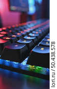 Close up of professional gaming keyboard with colorful LED backlight in multiple colors. Technology in gaming or developer industry. Desktop computer accessories. Стоковое AI-видео, аниматор Sergey Grishin / Фотобанк Лори