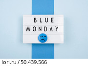 top view blue monday light box with sad face. Стоковое фото, агентство Ingram Publishing / Фотобанк Лори