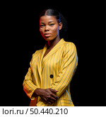 african woman yellow jacket. Стоковое фото, агентство Ingram Publishing / Фотобанк Лори