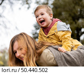 close up mother carrying son. Стоковое фото, агентство Ingram Publishing / Фотобанк Лори