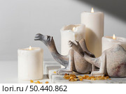 epiphany day camel figurines with candles raisins. Стоковое фото, агентство Ingram Publishing / Фотобанк Лори