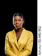 fashionable african woman yellow jacket. Стоковое фото, агентство Ingram Publishing / Фотобанк Лори