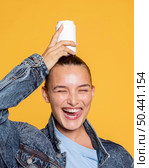 front view smiling woman with soda can. Стоковое фото, агентство Ingram Publishing / Фотобанк Лори