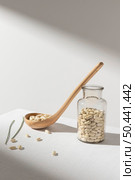 jar filled with beans spoon. Стоковое фото, агентство Ingram Publishing / Фотобанк Лори