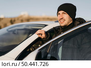 medium shot man with car. Стоковое фото, агентство Ingram Publishing / Фотобанк Лори