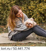 medium shot woman holding cute dog. Стоковое фото, агентство Ingram Publishing / Фотобанк Лори