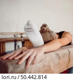 young blonde woman training balance beam. Стоковое фото, агентство Ingram Publishing / Фотобанк Лори