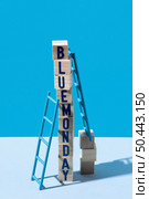 blue monday with wooden cubes ladders. Стоковое фото, агентство Ingram Publishing / Фотобанк Лори
