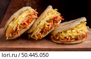 three arepas with delicious filling. Стоковое фото, агентство Ingram Publishing / Фотобанк Лори