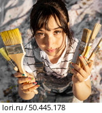 top view female painter with paintbrushes. Стоковое фото, агентство Ingram Publishing / Фотобанк Лори