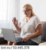 woman home quarantine having video call. Стоковое фото, агентство Ingram Publishing / Фотобанк Лори